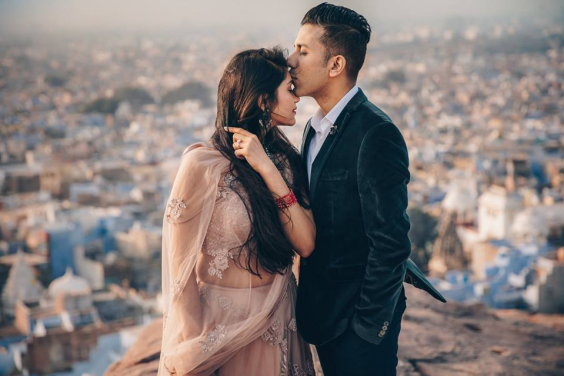 A kiss on forehead pre-wedding pose