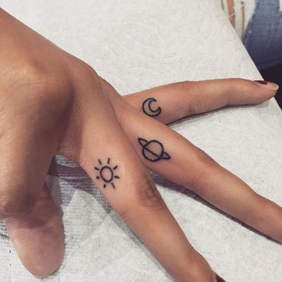 Planets In Fingers Tattoo